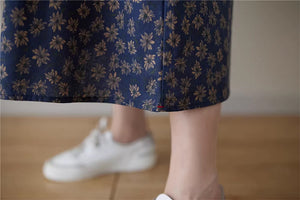 Chân váy linen retro lưng thun túi chéo in hoa cúc liti - NU9156