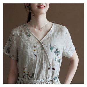 Đầm liền linen hoa lá ngắn tay cổ V vạt chéo eo thắt dây - NU10023