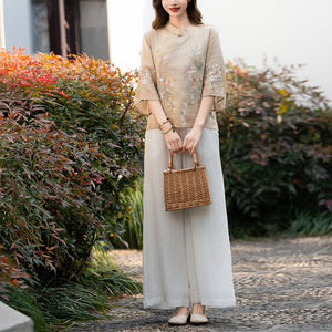 Áo sơ mi linen ngắn tay khuy tròn cài lệch thêu hoa lá - NU10055