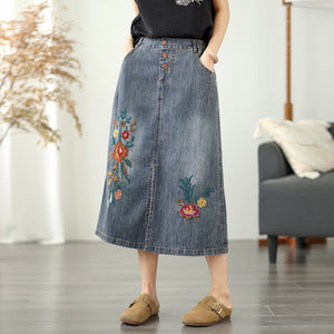 Chân váy denim lưng thun thêu hoa lá vạt xẻ trước - V106