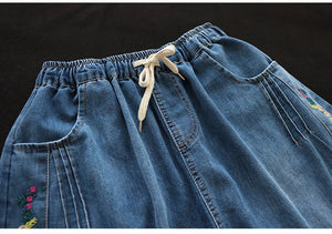 Chân váy denim lưng thun dây rút thêu hoa lá - NU8874