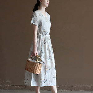 Đầm liền linen hoa lá ngắn tay cổ V vạt chéo eo thắt dây - NU10023