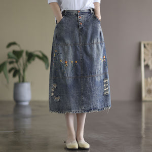 Chân váy denim lưng thun ba khuy cài thêu hoa lá - V007