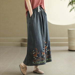 Chân váy denim lưng thun dây rút thêu hoa lá - NU10450