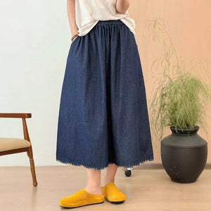 Chân váy denim lưng thun vạt thêu hoa - V103