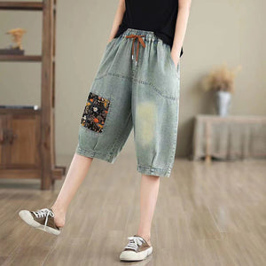 Quần sooc denim lưng thun dây rút thêu ô cửa hoa lá - NU10494