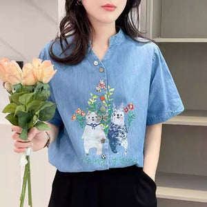Áo sơ mi denim ngắn tay cổ đứng in hoạt hình - NU8899