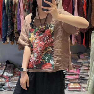 Áo T-shirt linen ngắn tay cổ tròn in hoa lá vạt xẻ - NU10443