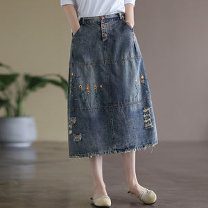 Chân váy denim lưng thun ba khuy cài thêu hoa lá - V007