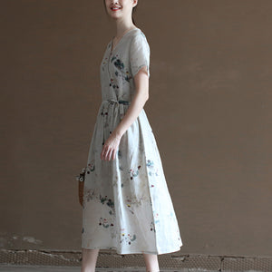 Đầm liền linen hoa lá ngắn tay cổ V vạt chéo eo thắt dây - NU10023