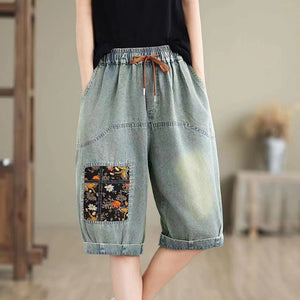 Quần sooc denim lưng thun dây rút thêu ô cửa hoa lá - NU10494