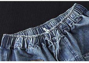 Chân váy denim lưng thun thêu hoa lá hia túi ngang - NU10150