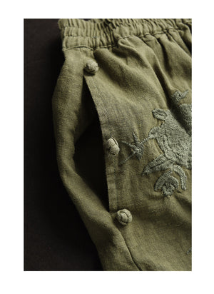 Chân váy linen lưng thun túi chéo thêu hoa văn khuy tròn - NU10250