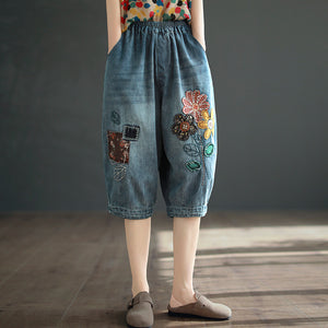 Quần baggy lửng denim lưng thun thêu hoa lá và ô vuông - NU8746