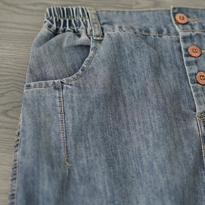 Chân váy denim lưng thun thêu hoa lá vạt xẻ trước - V106