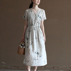 Đầm liền linen hoa lá ngắn tay cổ V vạt chéo eo thắt dây - NU10023
