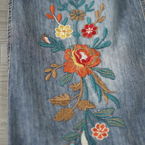 Chân váy denim lưng thun thêu hoa lá vạt xẻ trước - V106