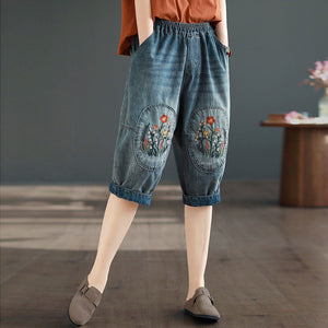 Quần baggy lửng denim lưng thun thêu hoa lá đối xứng - NU8884