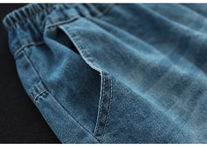 Quần baggy lửng denim lưng thun thêu hoa lá đối xứng - NU8884