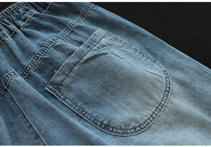 Quần baggy lửng denim lưng thun thêu hoa lá đối xứng - NU8884