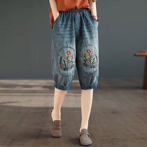 Quần baggy lửng denim lưng thun thêu hoa lá đối xứng - NU8884
