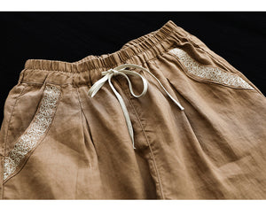 Quần baggy linen lưng thun dây rút hai túi viền thêu hoa văn - NU7167