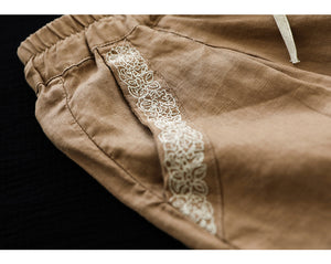 Quần baggy linen lưng thun dây rút hai túi viền thêu hoa văn - NU7167