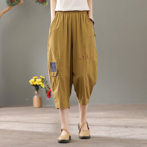 Quần baggy linen lưng thun thêu hoa văn hai túi chéo - NU6877