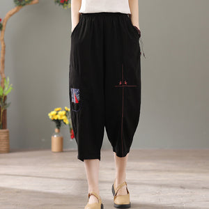Quần baggy linen lưng thun thêu hoa văn hai túi chéo - NU6877
