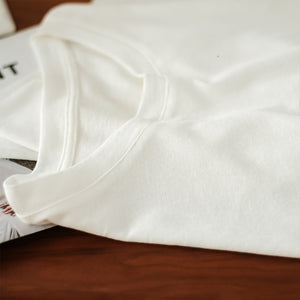Áo T-shirt ngắn tay cổ tròn vạt chéo in những vòng tròn - NU7243