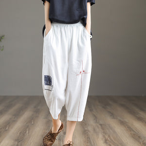 Quần baggy linen lưng thun thêu hoa văn hai túi chéo - NU6877