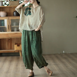 Áo T-shirt linen ngắn tay cổ V lệch tà in cỏ ba lá - NU7368