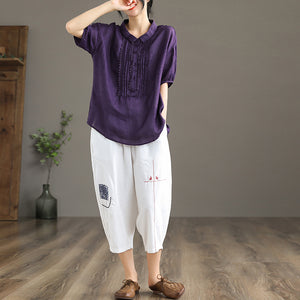 Quần baggy linen lưng thun thêu hoa văn hai túi chéo - NU6877