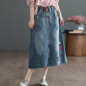 Chân váy denim lưng thun thêu những bông hoa một túi sau - NU8292