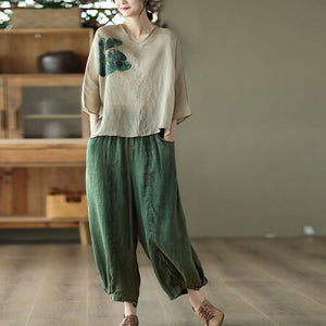 Áo T-shirt linen ngắn tay cổ V lệch tà in cỏ ba lá - NU7368